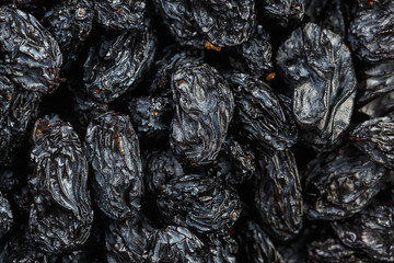 Black Raisin texture, popular dried fruit. Dried grapes.