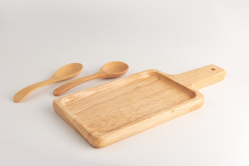 Wood plate and spoon isolated on white background