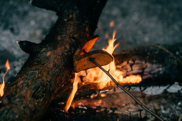 Bread on stick fried on fire