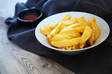 Golden French fries potatoes ready to be eaten
