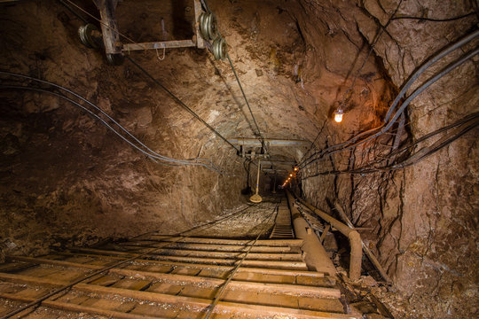 Underground gold iron ore mine shaft incline tunnel gallery passage human road