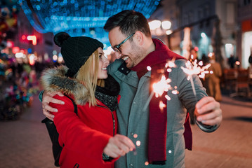 Affectionate couple enjoy spending time together on Christmas holiday.