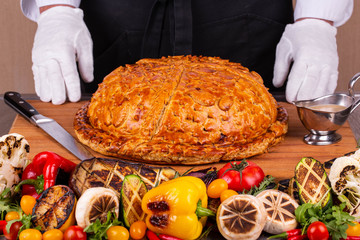 The meat pie made in the furnace with grilled vegetables