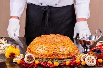 Giving of meat pie with mushrooms and grilled vegetables