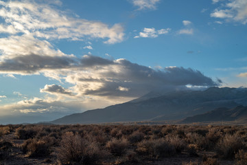 cloudy November sky over Eastern Sierra Nevada hills, mountains, desert valley, California, USA