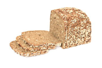 Loaf of fresh sliced multigrain gluten free bread with sesame, flax seeds, isolated on white.