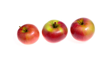 Three red apples isolated on a white