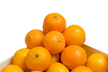 Ripe tasty tangerines in wooden box isolated on white. Winter time. Christmas time