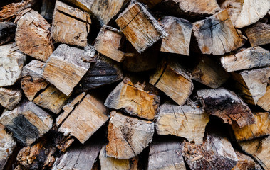Firewood for the winter, stacks of firewood, pile of firewood.