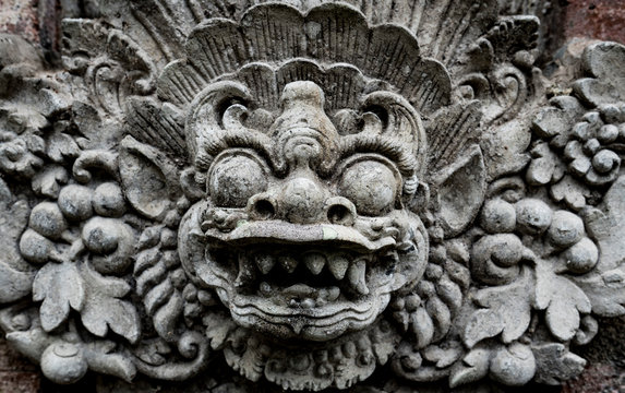 Balinese demon carved in stone