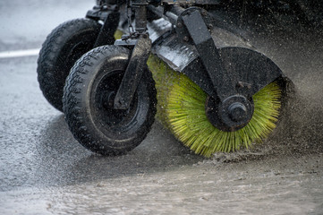 Hinged brush roller for cleaning streets and sidewalks close-up