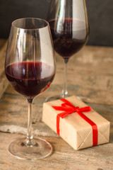 wine - red wine in a transparent glass on a wooden table. Top view. copy space