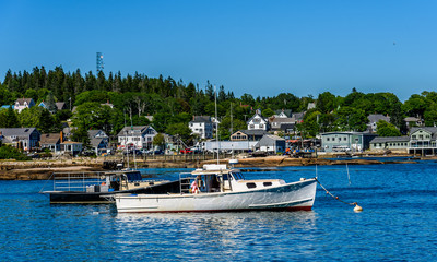 Fototapeta na wymiar Lobster Boats Anchored in a Maine Harbor