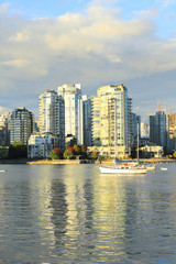 Fototapeta na wymiar Vertical sunny scene of the Vancouver, Canada skyline