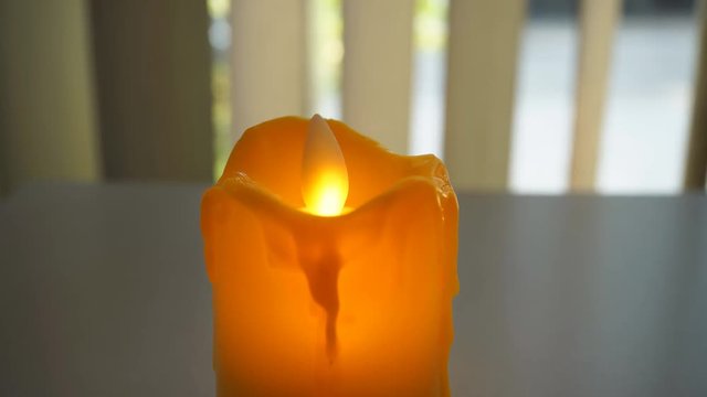 4K closeup toy yellow candle light