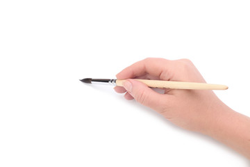 Hand with paint brush on white background