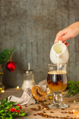 Coffee (cup of coffee) arabica in a transparent cup on a wooden table. Top view. copy space