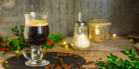 Coffee (cup of coffee) arabica in a transparent cup on a wooden table. Top view. copy space