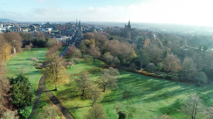 Low level aerial image of Pittencrieff Park in Dunfermline on an early winter’s day with hazy sunlight.
