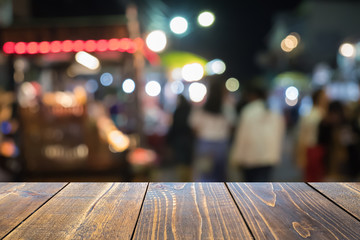 Empty wooden table of brown blurred background, colorful bokeh, presentation product