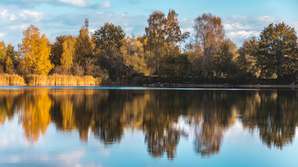 Beautiful autumn view with reflections at a pond near Aholming-Bavaria-German