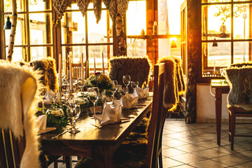 Set tables for dinner in a conservatory