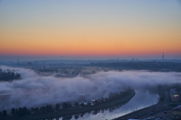 District Prague 6, Dejvice, with Vltava river a few minutes before sunrise with fog over the water during cold autumn day, Prague, capital of Czech Republic. 