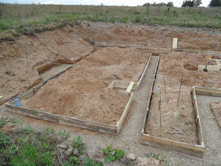 Construction of the foundation of a residential building in a construction pit