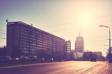 Vintage stylized picture of a street in Szczecin City against the sun, Poland.