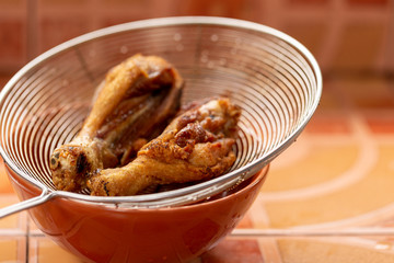 Fried chicken in hot oil and boiling in pan