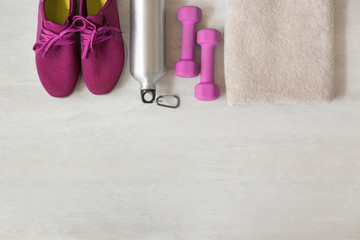 Flat lay composition with fitness equipment and space for text on gray background