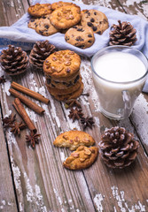 Christmas cookies for Santa Claus with cup of milk on a wooden background , copy space,