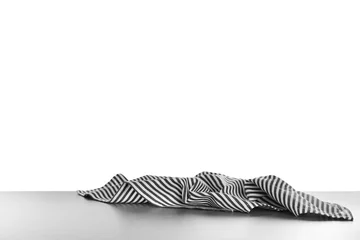 Zelfklevend Fotobehang Crumpled napkin on table against white background © New Africa