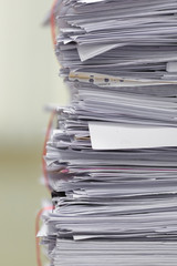 Document pile on office desk, Stack of business paper on the table with blurred of meeting room