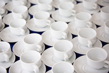 roup of empty Many rows of white ceramic coffee or tea cups