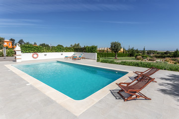 Sun bath with sun loungers and parasol. In Portugal.