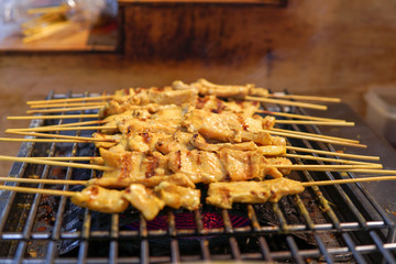 Moo Sa Tae Thai traditional food, Fermented pork with curry powder and grill with herb on the charcoal.Good tase delicious and famous in Thai restaurant.street food market in Thailand.