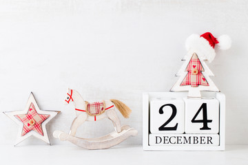 Christmas backgrounds. Christmas calendar, 24 december on the gray background.