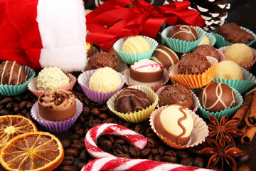 a lot of variety chocolate pralines, belgian confectionery gourmet chocolate and christmas spices with apples