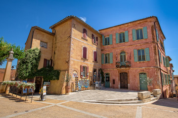 Fototapeta na wymiar Town Hall on the main square Place De La Mairie in Roussillon, Luberon, Provence, Vaucluse, France