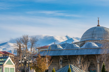 Lalapasa mosque with palandoken mountain background with snow in Erzurum, Turkey