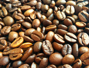 Roasted brown coffee beans texture background. Сlose up pattern photography