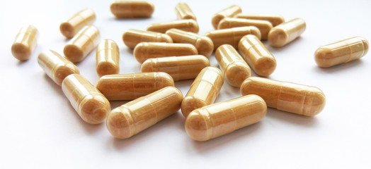 Pharmaceutical medicine capsules on white background. Pharmacy theme, health care, drug prescription for treatment medication and pharmaceutical medicament