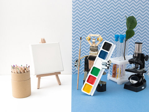 Metal robot with a brush in his hand. Stem plus art is equal to STEAM. Science, technology, engineering, art, mathematics. Concept of new methods of teaching children and teenagers. 