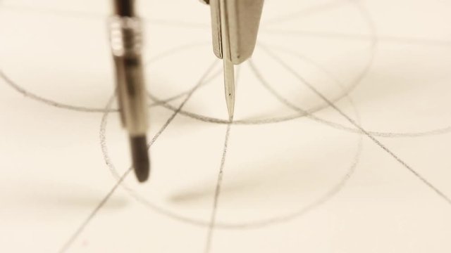 designer or engineer works with drawings using a compass