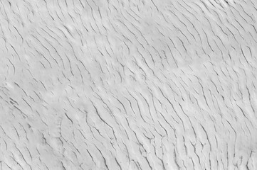 Wavy black white texture of natural mineral stone travertine