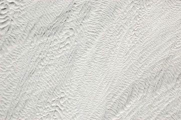 Fototapeta na wymiar White wavy Venetian plaster background texture