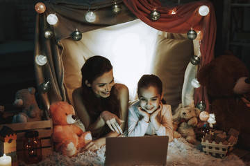 Mother and Daughter Using a Laptop