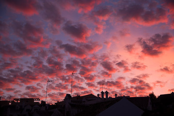 urban silhouette and skies with cirrocumulus clouds at dusk, © imago1956rs