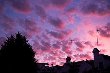urban silhouette and skies with cirrocumulus clouds at dusk, © imago1956rs